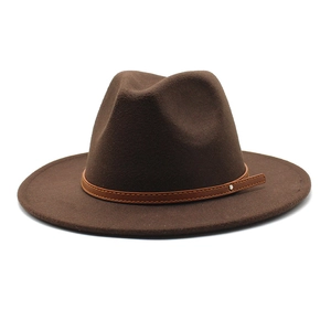 Detailed view of dark brown fedora hat with leather band and silver metal rivet decoration