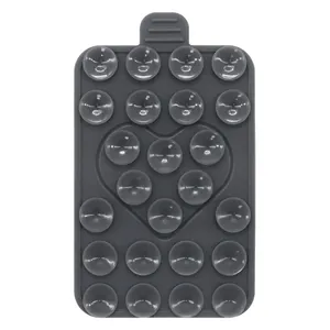 Detail view of heart-shaped silicone suction cup phone holder with 24 small suckers