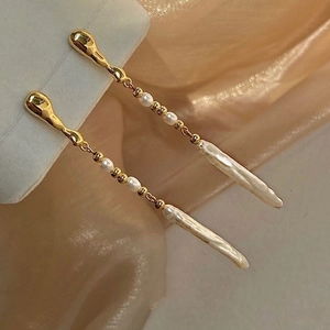 Modern baroque freshwater pearl drop earrings with long gold tassel and silver needles