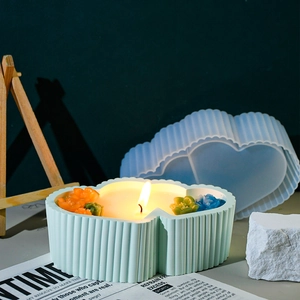 Macro detail of a heart-shaped striped candle jar silicone mold with a finished plaster box