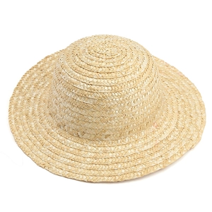 Close-up of fine wheat straw weave texture on a classic wide brim summer sun hat
