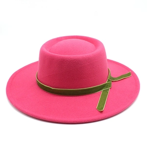 Detail of rose red wool felt fedora with olive green velvet ribbon and side tie knot