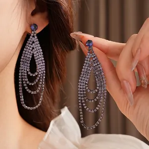 Elegant long tassel drop earrings with purple rhinestones in a tiered waterdrop design