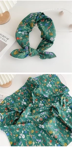 Detail showing green floral fabric headband with yellow small flowers and white edging