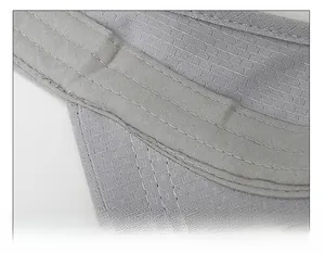 Macro detail of breathable widened sweatband and precision stitching on grey sun visor