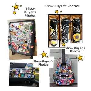 Waterproof Tree of Life stickers applied to luggage, guitar, and water bottle