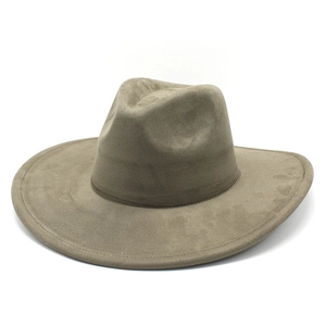 Detail of taupe suede wide brim fedora hat showing premium stitching and classic crown shape