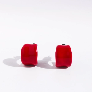 Irregular wide C-shaped mirror finish red earrings with minimalist aesthetic style