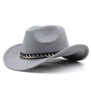 Detail of grey felt cowboy hat featuring black leather strap and gold chain accent
