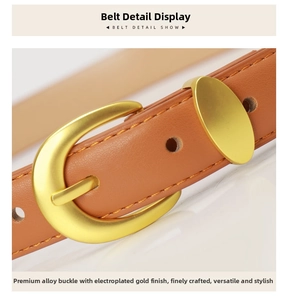 Detailed close-up of brown leather belt with gold D-shaped alloy buckle and fine stitching