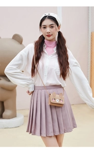 Brown PU leather rabbit shaped crossbody bag worn by a child in a playful setting