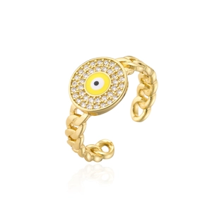 Macro detail of gold motorcycle chain ring with cubic zirconia and evil eye enamel charm