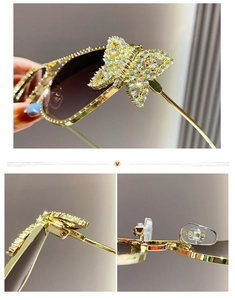 Detail of metal sunglasses featuring butterfly rhinestone decor and gold frame hinges
