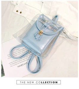 Detail view of light blue transparent PVC backpack with metal twist lock and drawstring closure