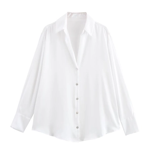 Detailed close-up of white silk satin long sleeve shirt with premium button cuffs