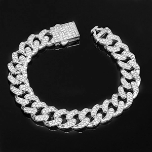 Macro shot of silver 12.5mm Cuban link chain with luxury iced-out diamond buckle