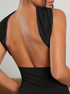Slim fit backless tube top in black high-stretch knit fabric with halter neck design
