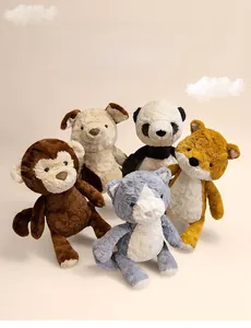 Group shot of five assorted animal plush toys featuring monkey, panda and fox details