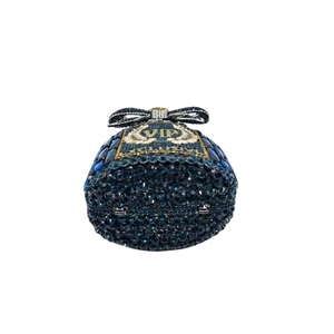 Detailed close-up of dark blue crystal clutch bag with VIP diamond inlay and bow clasp