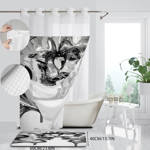 Detail view of the black and white abstract fluid shower curtain and non-slip bath mat set