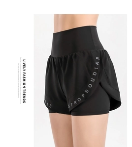Detail view of high-waist black sports shorts with double-layer anti-exposure design
