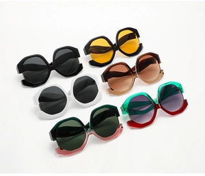 Selection of oversized cat-eye sunglasses in various colors with bold geometric frames