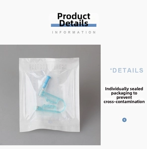 Detail of disposable ear piercing gun in sterile packaging with medical steel needle