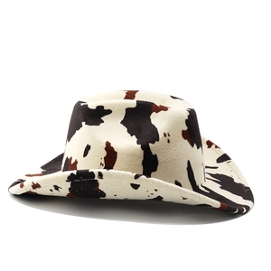 Detail of western cowboy hat with cow print pattern and premium felt texture