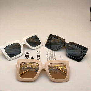 Chic square oversized sunglasses in white, black, and beige with gold metal temples