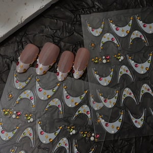 French manicure stickers with colorful dots and crescent moon patterns on black texture