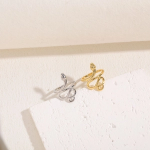 Minimalist snake-shaped wrap ring with zircon details in gold and silver finish