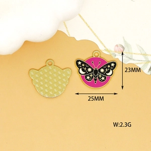 Macro view of black butterfly enamel charm with gold celestial details and dimensions