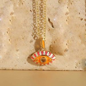 Detailed close-up of zircon Evil Eye pendant with colorful enamel on a gold chain
