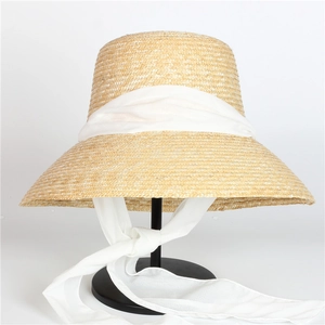 Classic Hepburn style wide brim straw hat with elegant white ribbon ties for sun protection