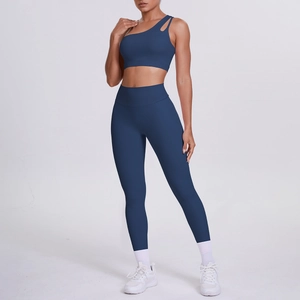 Detail of navy one-shoulder cutout yoga bra and high-waist leggings set for fitness