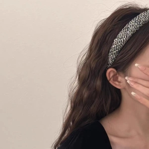Detail of silver woven headband on model showing metallic texture and French vintage style