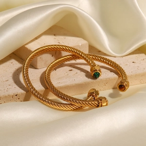 Golden twisted cable open cuff bracelet with green malachite and brown tiger eye stones