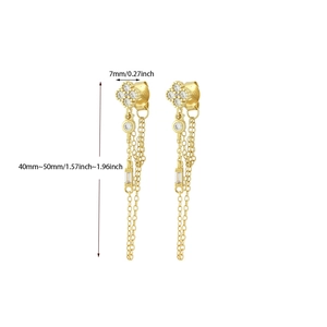 Detail view of gold tassel earrings with zircon clover and measurement markings