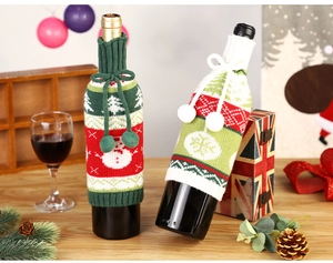 Detailed texture of knitted Christmas wine bottle covers with snowman and snowflake patterns