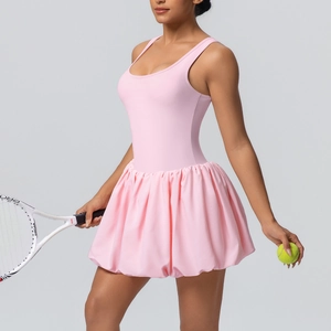 Detailed close-up of pink tennis dress featuring pleated skirt and athletic fabric