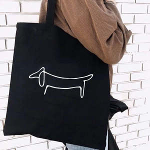 Minimalist black canvas dachshund tote bag for women showing spacious casual style