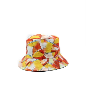 Detail of colorful geometric art print on reversible bucket hat with reinforced stitching