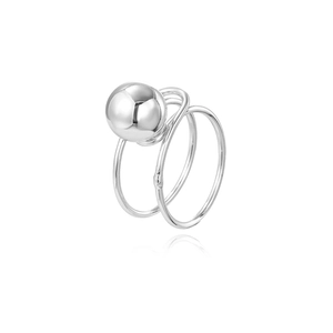 Close-up of modern double-layer silver ring with smooth hollow metal ball detail