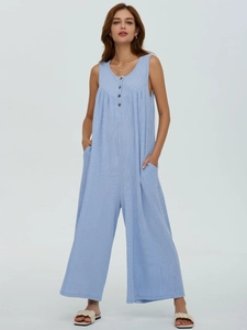 Detail of light blue striped sleeveless jumpsuit with functional side pockets