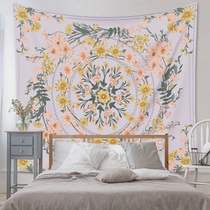 Close-up of mandala floral tapestry with yellow sunflowers and pink daisies on fabric