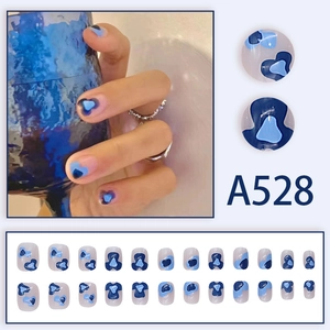 Summer blue marbled press-on nails set with abstract heart designs for a cool aesthetic