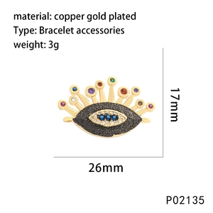 Close-up of gold-plated evil eye connector with colorful zircon and shell inlay details
