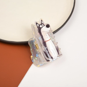 Detail view of husky cartoon hair claw with holographic finish on a white plate