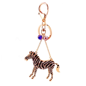 Sparkling zebra keychain featuring rhinestones and black enamel with crystal charms