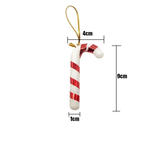 Close-up of a 9cm red and white striped candy cane ornament with gold hanging string